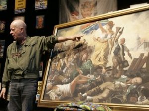 South African artist Pieter-Dirk Uys shows a painting that gives comment on South African politics and shows different South African leaders in Cape Town, South Africa, Wednesday,  April 8, 2009. South Africa's top satirist, who was long a thorn in the flesh of the apartheid regime, on Wednesday accused the ruling party of intimidating its critics and threatening press freedom. (AP Photo/Schalk van Zuydam)